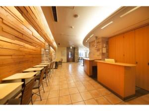 a row of tables and chairs in a restaurant at R&B HOTEL HIGASHI NIHONBASHI - Vacation STAY 40472v in Tokyo +12 photos