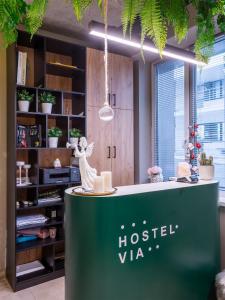 a green counter with a statue of a horse on it at VIA Hostel in Kazan