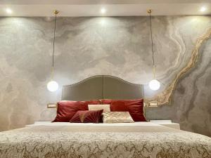 a bed with a white bedspread and pillows in a room at Palazzo Bianchi - Trani in Trani