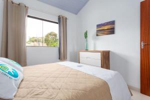 Postel nebo postele na pokoji v ubytování Arpoador Apts Praia & Piscina - Buzios Rentals