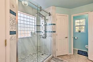 a bathroom with a shower with a glass shower stall at Near Trails, Lakes and Golf Pinetop Home with Deck in Pinetop-Lakeside +23 photos
