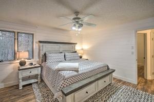 a bedroom with a bed and a ceiling fan at 15 Mi to Hot Springs Natl Park Home with Fire Pit! in Hot Springs Village