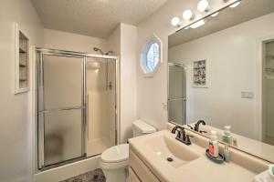 a bathroom with a sink and a shower and a toilet at 15 Mi to Hot Springs Natl Park Home with Fire Pit! in Hot Springs Village +28 photos