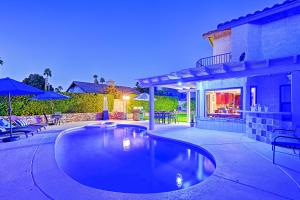a swimming pool in the backyard of a house at Pet-Friendly La Quinta Gem with Pool and Yard Games in La Quinta