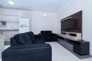 Μια τηλεόραση ή/και κέντρο ψυχαγωγίας στο Casa à 80m da praia