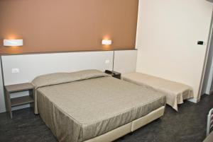 Postel nebo postele na pokoji v ubytování Hotel 4 Strade