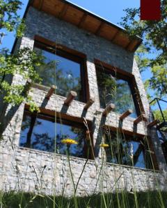 a building with windows on the side of it at La casa providencia - Costa del lago in Villa Pehuenia