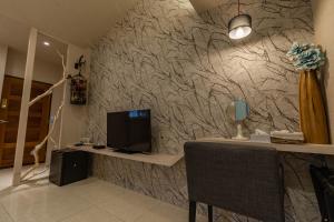 TV a/nebo společenská místnost v ubytování Yesday B&B