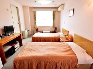 Postel nebo postele na pokoji v ubytování Resort Inn Marion Shinano