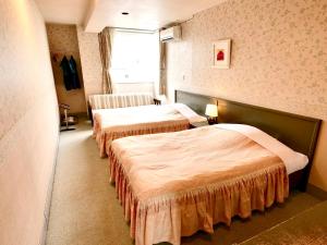 Postel nebo postele na pokoji v ubytování Resort Inn Marion Shinano