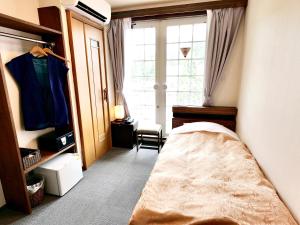 Postel nebo postele na pokoji v ubytování Resort Inn Marion Shinano
