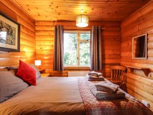 Säng eller sängar i ett rum på Rowan Lodge