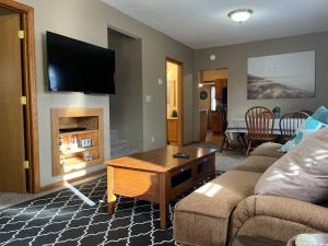 a living room with a couch and a table at Close to Duluth! Centrally Located-Lake Superior Minutes Away! in Superior