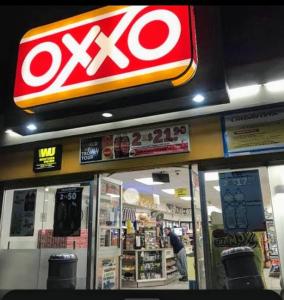 a store with a xo sign on the front of it at Azul departamento 34 m2 Nuevo in Jiutepec +14 photos