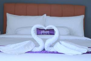 Ένα ή περισσότερα κρεβάτια σε δωμάτιο στο Plum Hotel Lading Banda Aceh