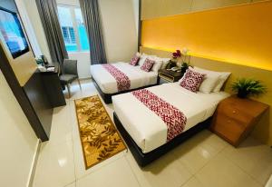 Postel nebo postele na pokoji v ubytování City Central Hotel