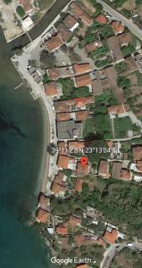 an aerial view of a village next to the water at Epavli Sofia' s two Apartments in Horto, 30m from the sea in Chorto