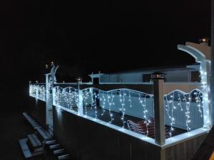 a bridge covered in christmas lights at night at Marmora and Lake Inn and Victorian Diner in Marmora