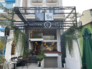 a store front of a building with a sign that reads teeling kitchen at Lyly's House - Homestay in Ho Chi Minh City