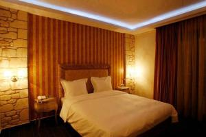 Кровать или кровати в номере Diamond River Resort & Spa