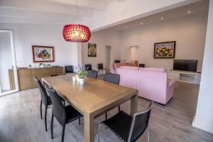 a dining room and living room with a table and chairs at E368 Casa Blanca by Mallorca Villa Selection in Alcudia