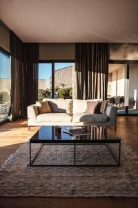 a living room with a couch and a coffee table at Villas Misto in Primošten