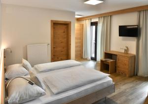 Voodi või voodid majutusasutuse Hotel Toblacherhof toas