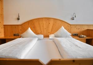 Voodi või voodid majutusasutuse Hotel Toblacherhof toas