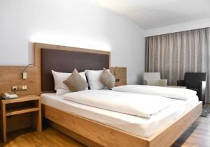 Voodi või voodid majutusasutuse Hotel Toblacherhof toas