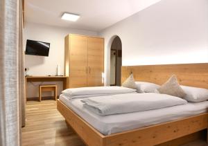 Voodi või voodid majutusasutuse Hotel Toblacherhof toas