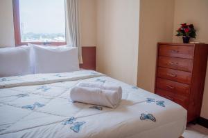 Ένα ή περισσότερα κρεβάτια σε δωμάτιο στο Majesty Homey 2BR Apartment +5 φωτογραφίες