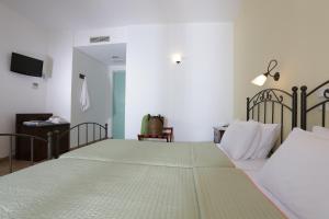 Voodi või voodid majutusasutuse Brazzera Hotel toas