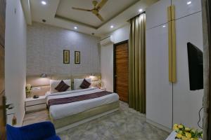 מיטה או מיטות בחדר ב-Hotel Fortune Inn- Noida Sector 19