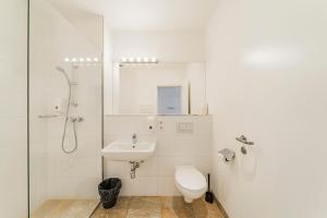 a bathroom with a toilet and a sink and a shower at Bianca Apartment 3 - Top Location in Vienna