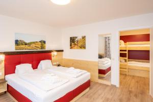 Postel nebo postele na pokoji v ubytování Genusshotel Almrausch