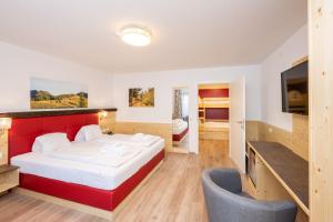 Postel nebo postele na pokoji v ubytování Genusshotel Almrausch