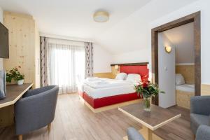 Postel nebo postele na pokoji v ubytování Genusshotel Almrausch
