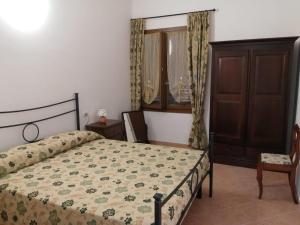 A bed or beds in a room at Vecchio Faro Residence