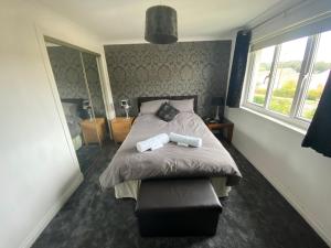 a bedroom with a bed and a window at Dreamhaven in Dunbar