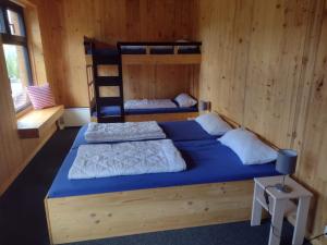 Postel nebo postele na pokoji v ubytování Jugendgästehaus Gerlosplatte