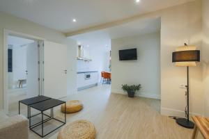 TV a/nebo společenská místnost v ubytování Apartamentos Magna Sevilla