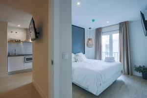 Postel nebo postele na pokoji v ubytování Apartamentos Magna Sevilla