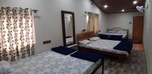 A bed or beds in a room at SilverShine Homestay