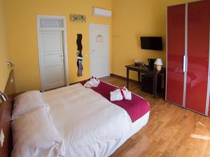 Postel nebo postele na pokoji v ubytování Residenza Viani Guest House + 24 fotografií