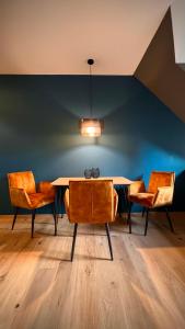 a dining room with a table and two chairs at H-85 SUITES LEVEL 5/10 in Koblenz