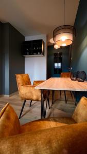 a dining room with a table and chairs at H-85 SUITES LEVEL 5/10 in Koblenz