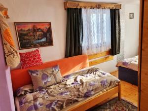Postel nebo postele na pokoji v ubytování Cabana Huta Sinteu