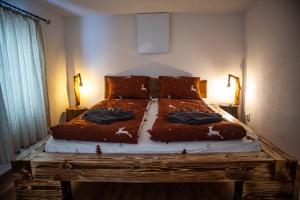 En eller flere senge i et værelse på Holiday Nature House