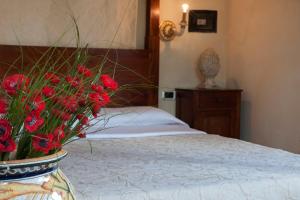 Postel nebo postele na pokoji v ubytování Relais Ciavatta Country Hotel