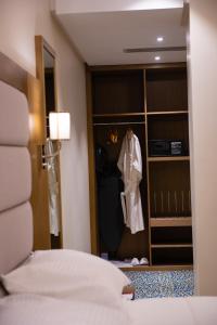 Letto o letti in una camera di ROZANA HOTEL